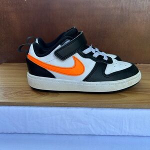 Nike Black and Orange Sneakers with Classic Swoosh